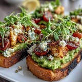 Vibrant avocado toast board with sourdough slices topped with creamy avocado spread and colorful fresh toppings.  
